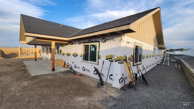View of side of home with a patio and roof with shingles | Image 7
