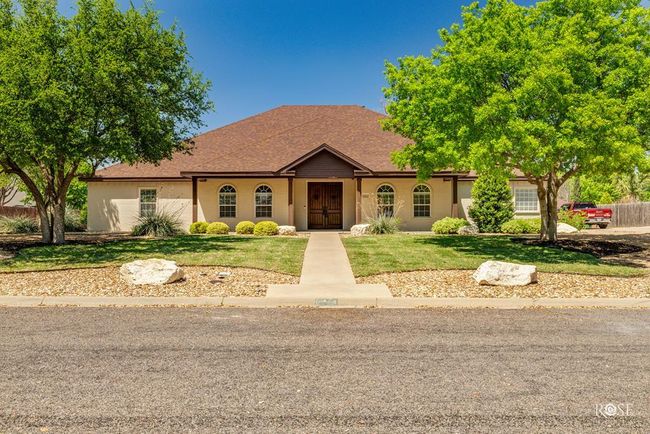 mature trees grace the front yard | Image 4