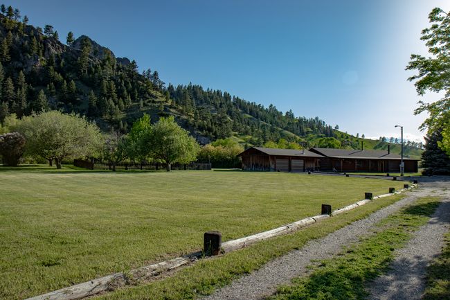 View of yard with a mountain view and a garage | Image 8