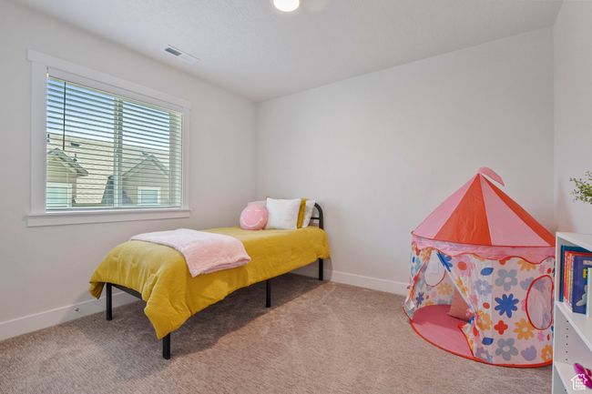 Bedroom featuring carpet | Image 21