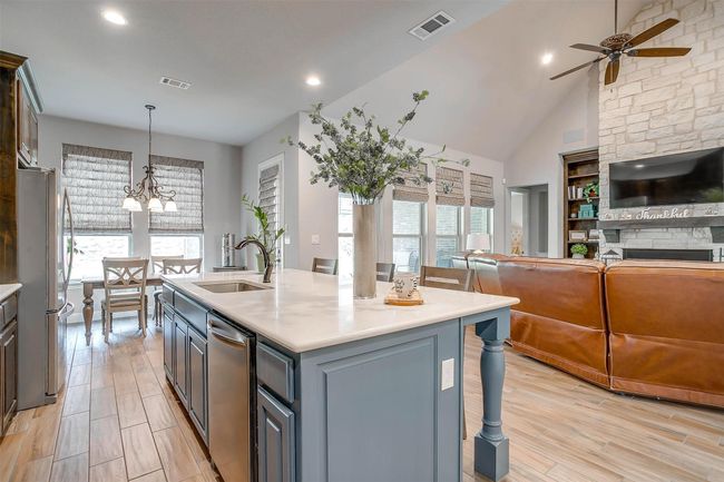 Kitchen with stainless steel appliances, ceiling fan, open floor plan, healthy amount of natural light, and recessed lighting | Image 13
