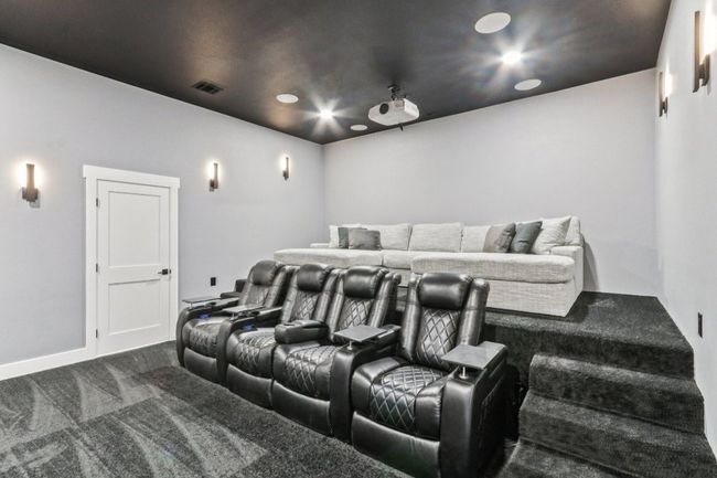 Cinema room with dark carpet and recessed lighting | Image 34