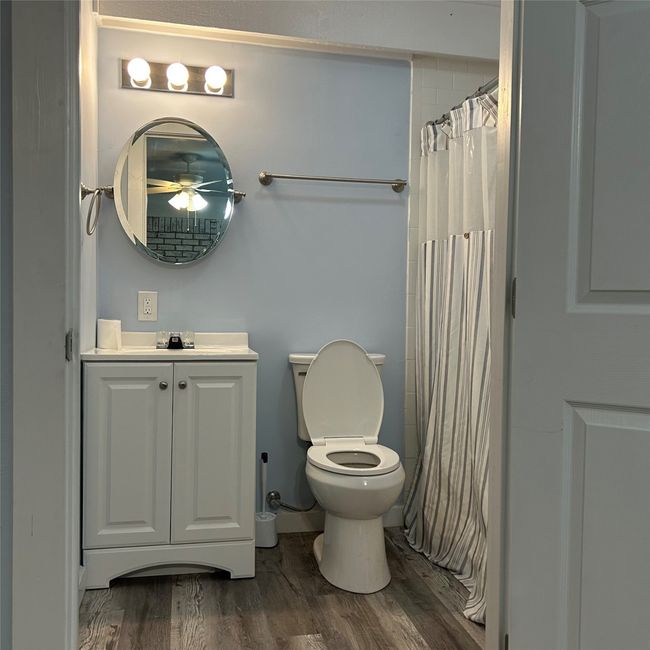 Bathroom with baseboards, vanity, and a textured ceiling | Image 17