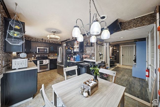 Dining room with a textured ceiling | Image 7