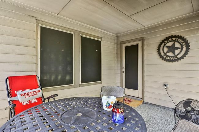 View of covered porch accessible from the dining area | Image 5
