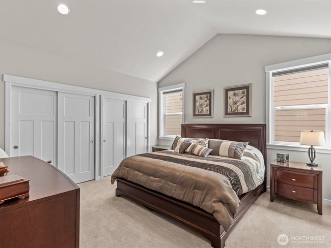 Double closets with gorgeous closet systems allow plenty of space for all of your wardrobe needs. | Image 18