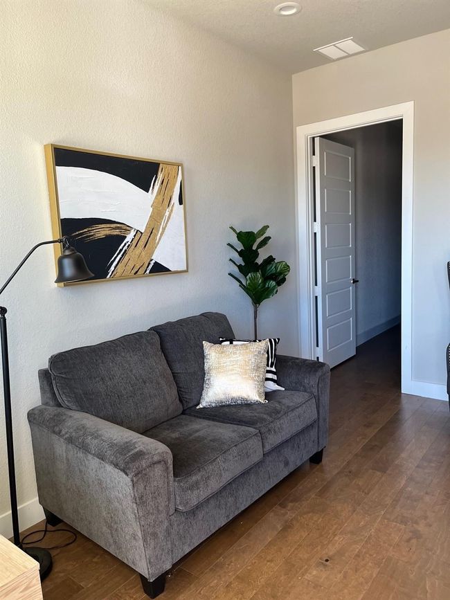 Living area featuring wood finished floors | Image 9