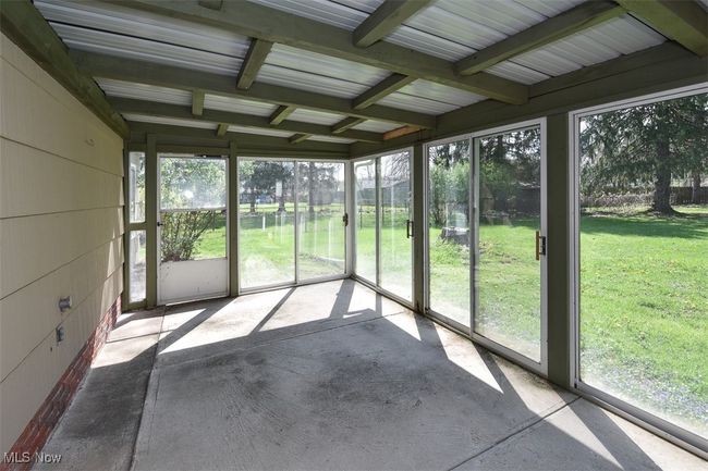 View of unfurnished sunroom | Image 10