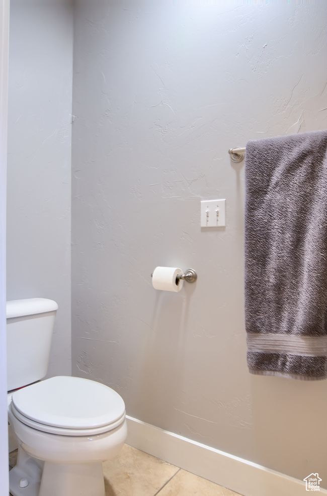 Bathroom with tile patterned floors and toilet | Image 29