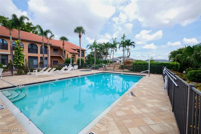 Community pool with a patio area | Image 38