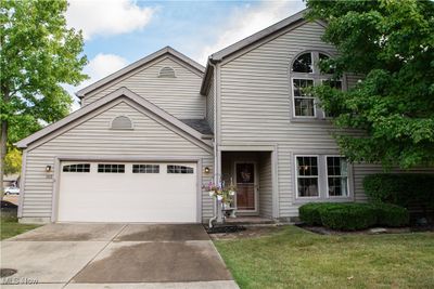 View of front property featuring a garage and a front yard | Image 1