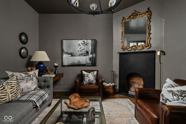 Den with hardwood floors, a chandelier, fireplace - could also be used as a 3rd bedroom. | Image 9