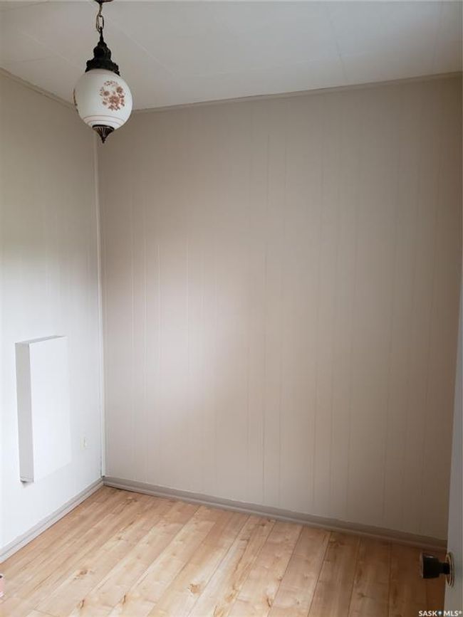 Cute second room can support many uses. Previous owner used as laundry room and plumbing is still in place behind panel. | Image 16