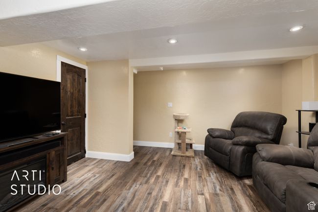 Sitting room featuring wood finished floors, baseboards, and recessed lighting | Image 4