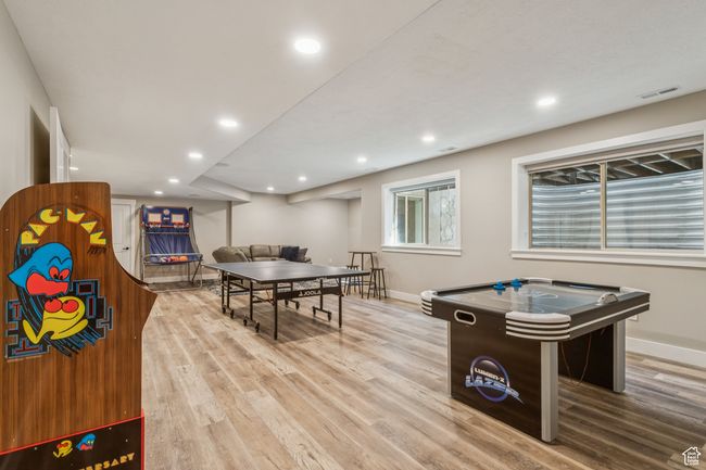 Game room featuring wood finished floors and recessed lighting | Image 52