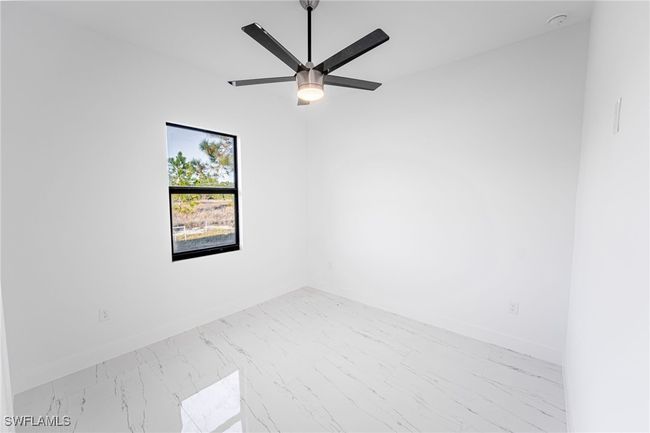 Unfurnished room with ceiling fan | Image 18