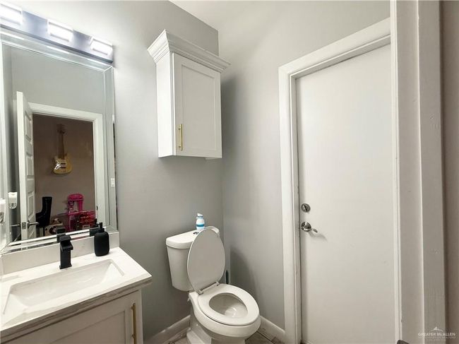 Bathroom with vanity and toilet | Image 16