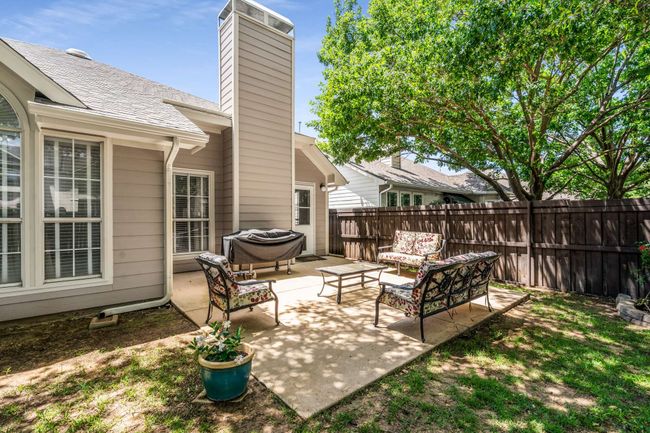 View of patio featuring an outdoor hangout area | Image 36