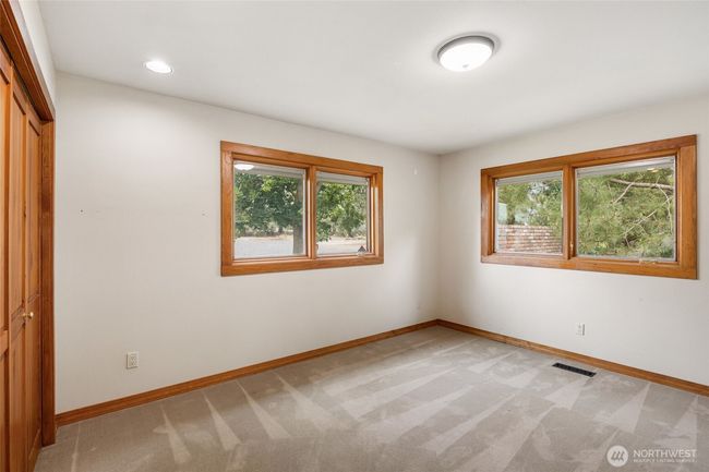Third bedroom with lake views and beautiful oak trim and pine closet doors. | Image 23