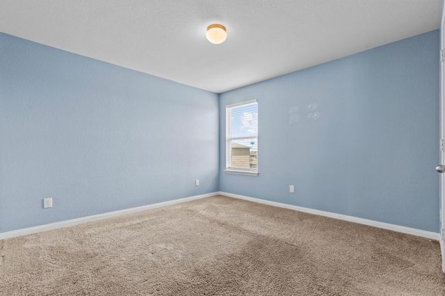 Carpeted spare room featuring baseboards | Image 11