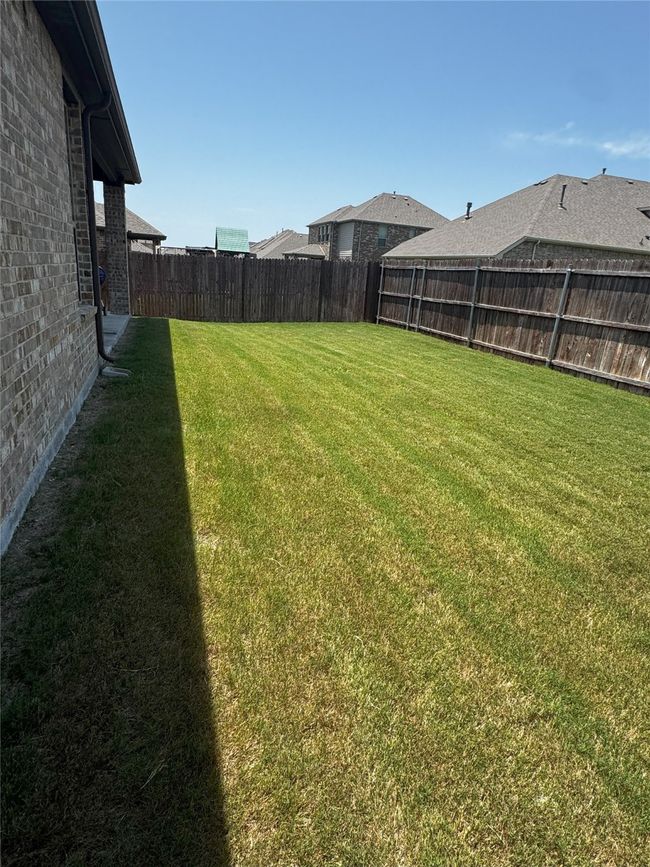 View of fenced backyard | Image 31