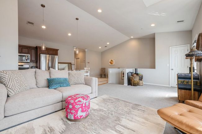 Living room with vaulted ceiling, baseboards, visible vents, recessed lighting, and carpet floors | Image 5