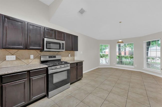 Kitchen. breakfast area by the windows. | Image 17