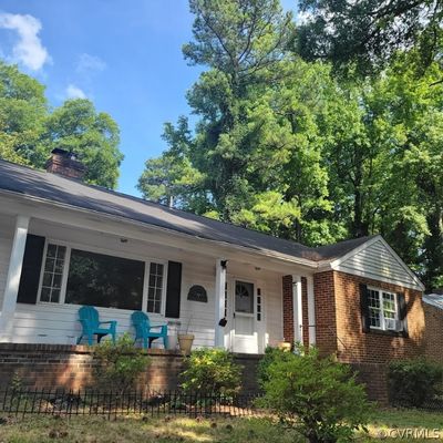 Ranch-style Brick house featuring a porch | Image 1