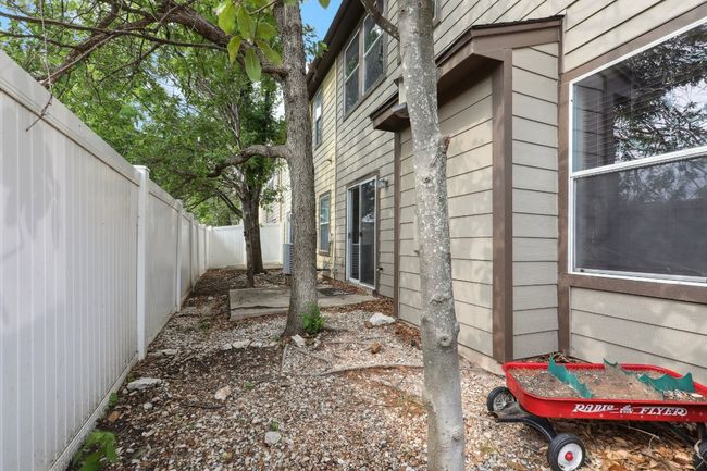 View of side of property featuring a fenced backyard | Image 34