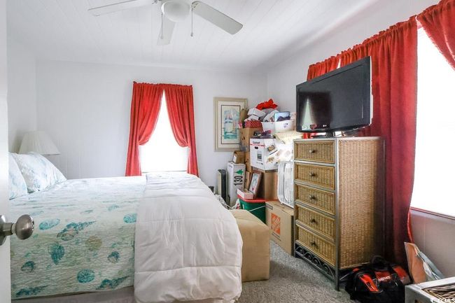 Bedroom featuring carpet floors and ceiling fan | Image 32