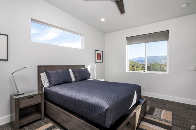 Bedroom featuring recessed lighting, baseboards, multiple windows, and wood finished floors | Image 21