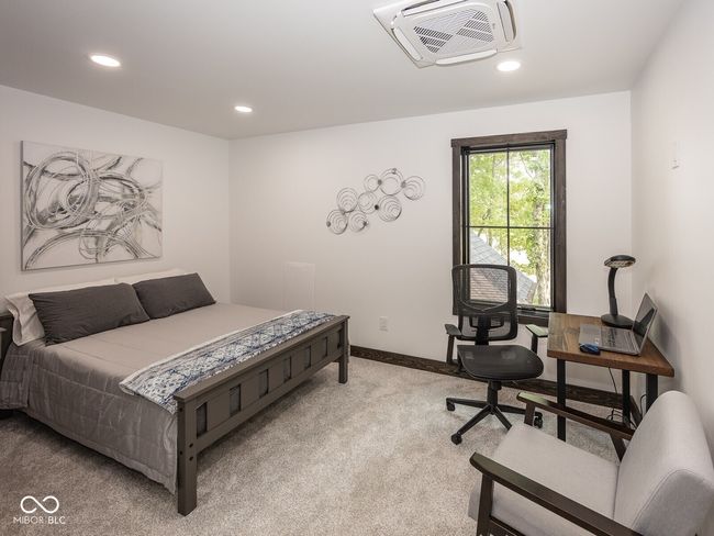 bedroom featuring light colored carpet, recessed lighting, and baseboards | Image 33