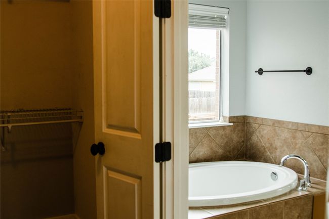 Bathroom featuring a garden tub | Image 22
