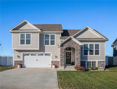 View of front of property featuring a garage and a front lawn | Image 3