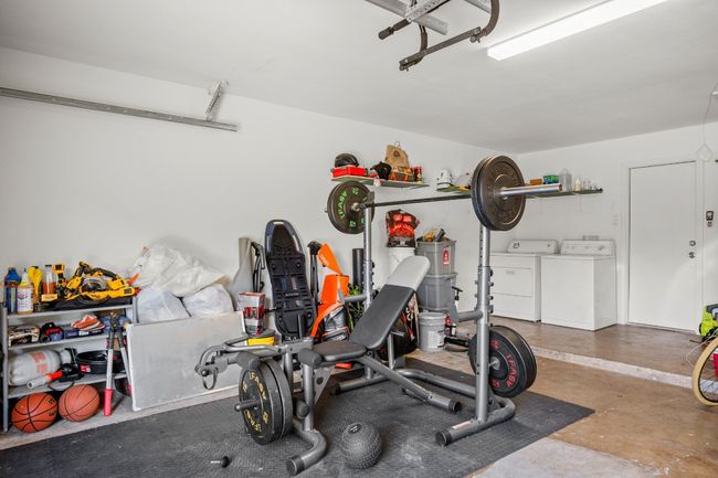 Garage featuring washing machine and dryer | Image 26
