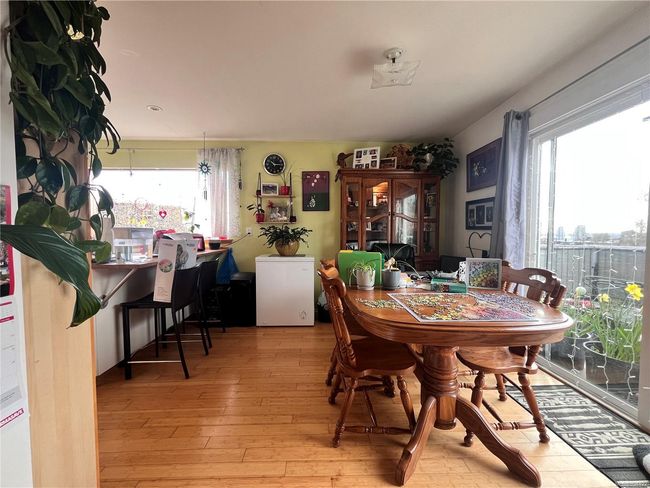 Dining room with plenty of natural light and wood flooring | Image 7