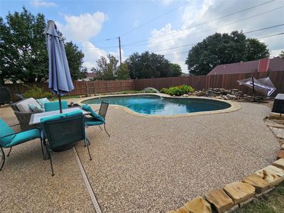 View of swimming pool featuring a patio area | Image 2