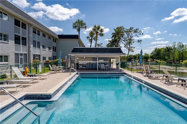 Pool featuring fence, a patio area, and outdoor dry bar | Image 27