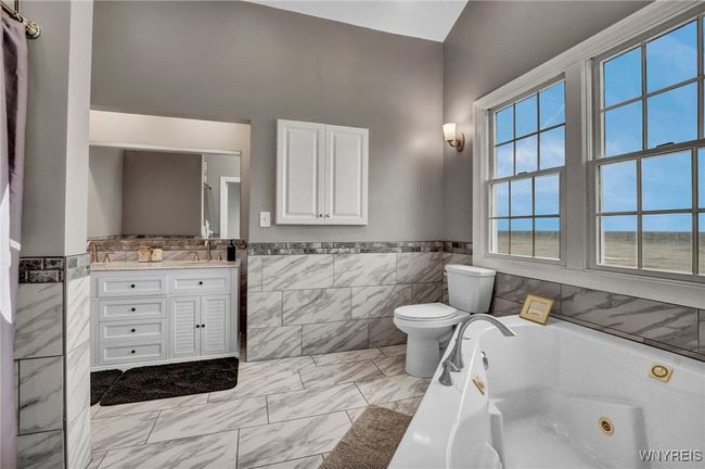 Primary Bedroom Ensuite with whirlpool soaking tub and exquisite tile work | Image 34