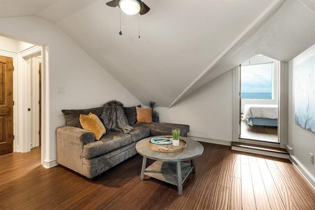 this area on top level of the home is a guest quarters and can be private from the rest of the home. Features a living area, bedroom, closet and kitchenette | Image 43