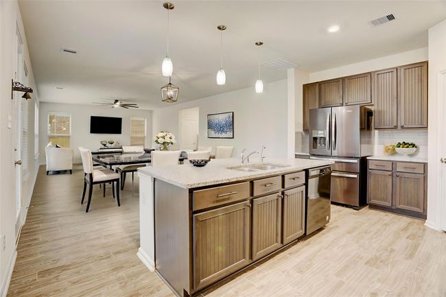 Another view of this generous-sized room with tall ceilings and ample light. | Image 10