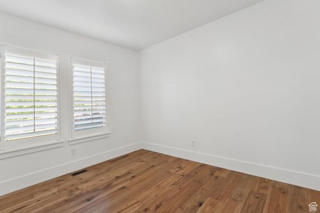 Unfurnished room featuring wood-type flooring and baseboards | Image 20