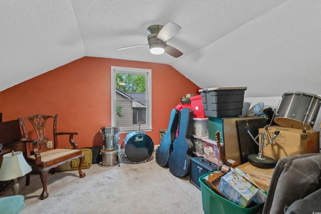 Bonus room featuring a ceiling fan and lofted ceiling | Image 22