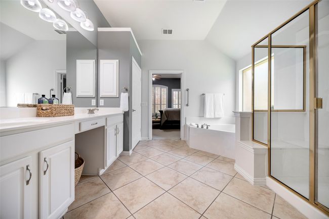 Primary bedroom ensuite features a tub, walk in shower, and 2 spacious linen closets. | Image 14
