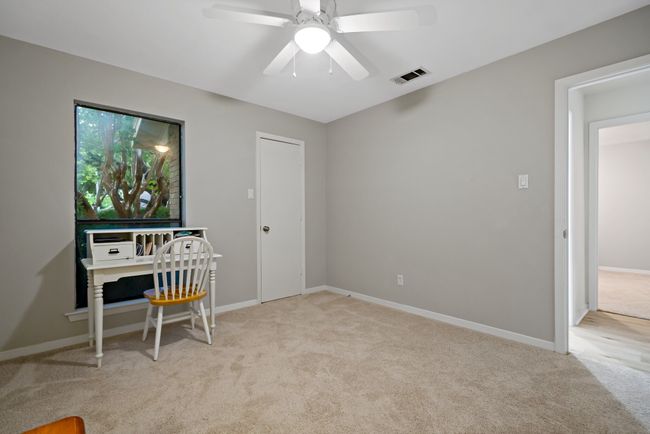 Bedroom space with baseboards, carpet, and ceiling fan | Image 17