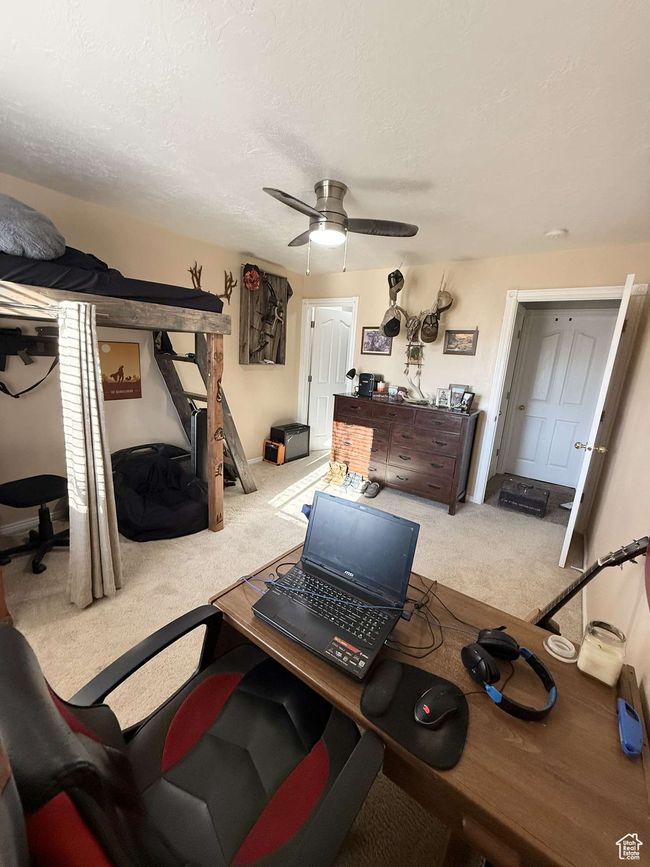 Home office with ceiling fan, carpet flooring, and a textured ceiling | Image 14