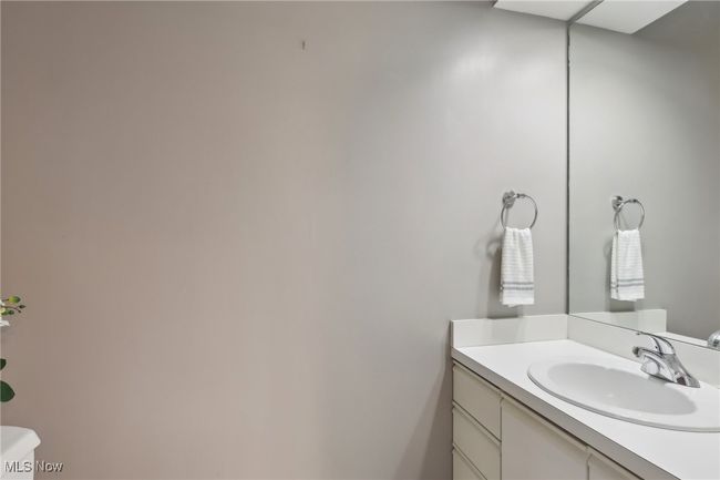 Main Floor Bathroom with toilet and vanity | Image 21