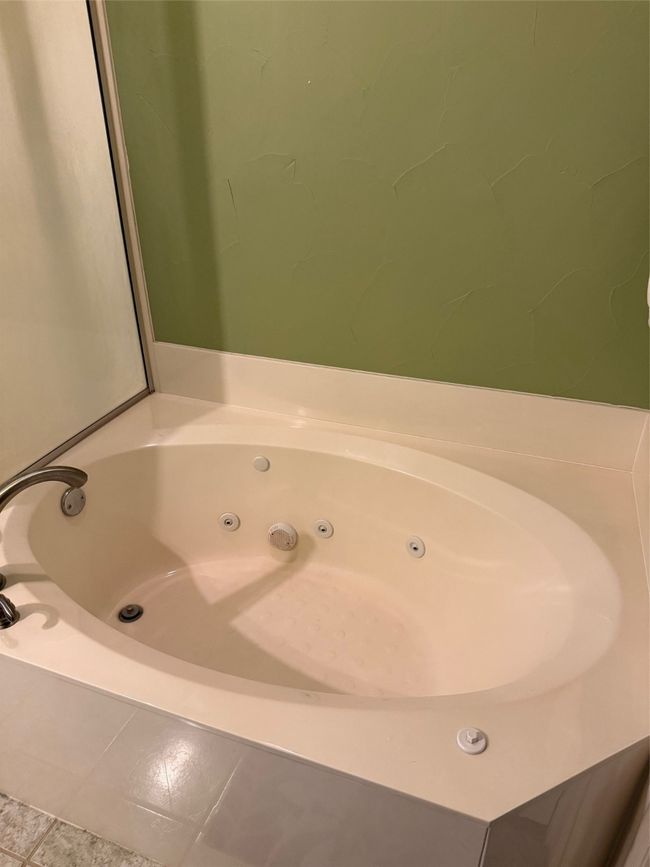 Bathroom featuring a whirlpool tub | Image 29