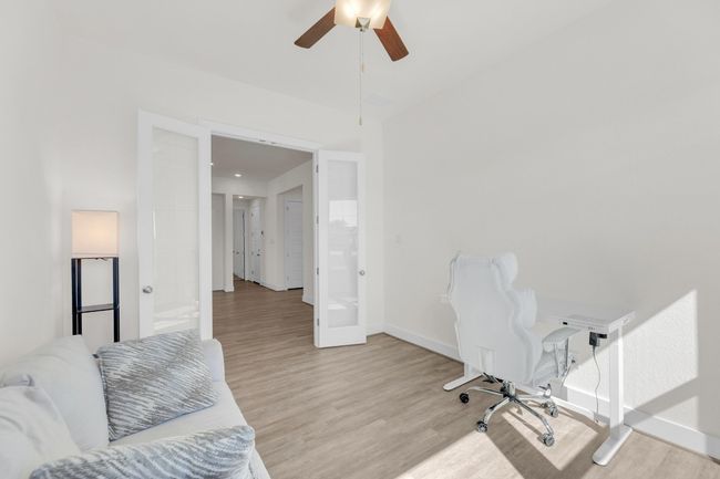 Office featuring wood finished floors, a ceiling fan, and baseboards | Image 34