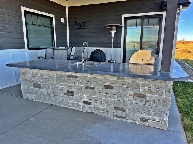 Custom outdoor kitchen w/ concrete countertops | Image 17